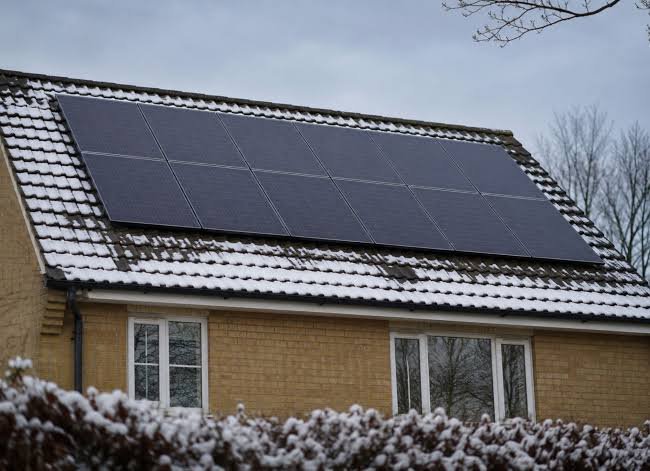 Solar panels on a roof in Scotland on an overcast winter day